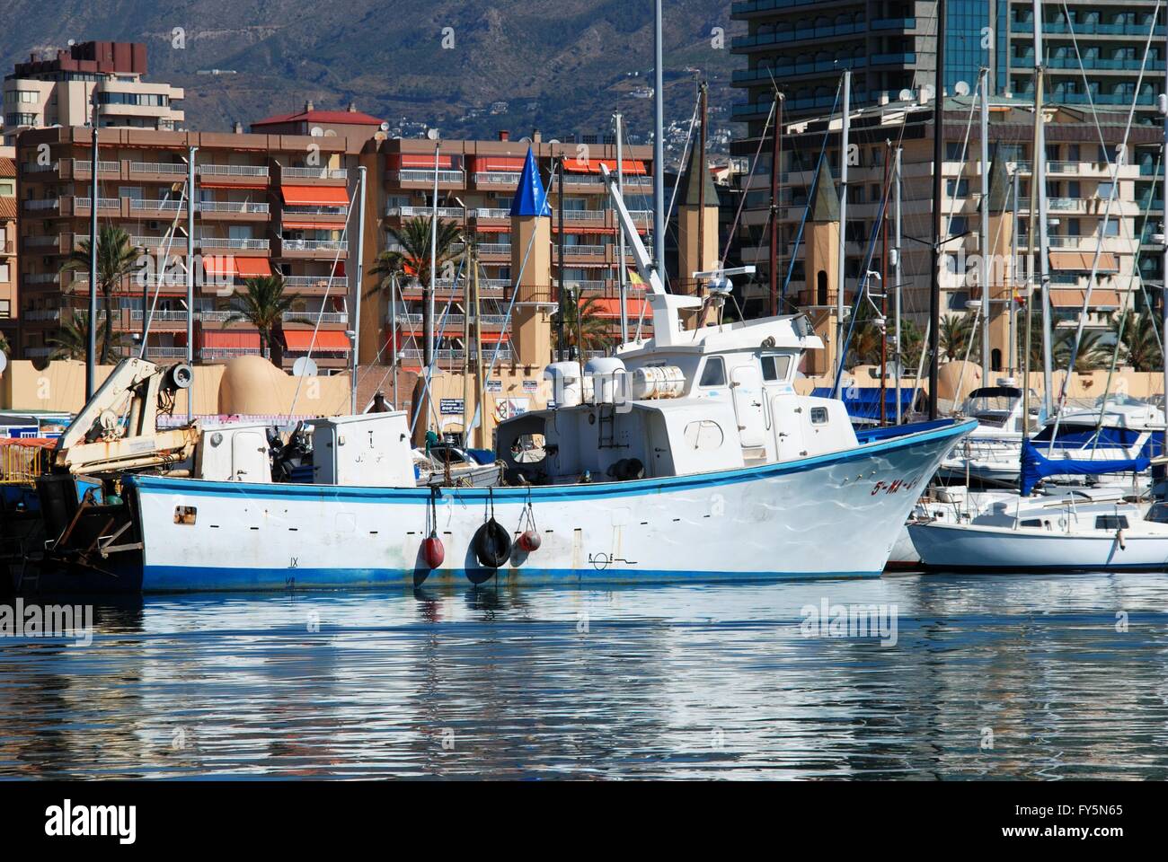 Traditional fishing boats and trawlers in the harbour, Fuengirola ...