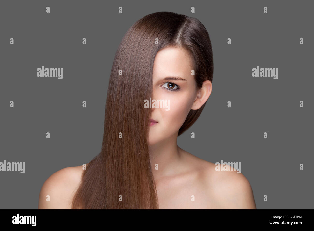 Beautiful young brunette with long straight hair Stock Photo