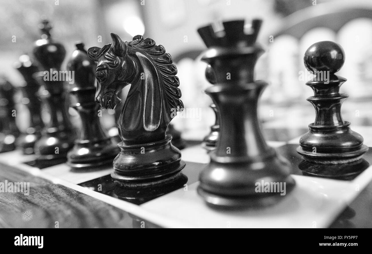 Chess pieces in starting position on a wooden Board Stock Photo by  ©Rostislavv 141334490