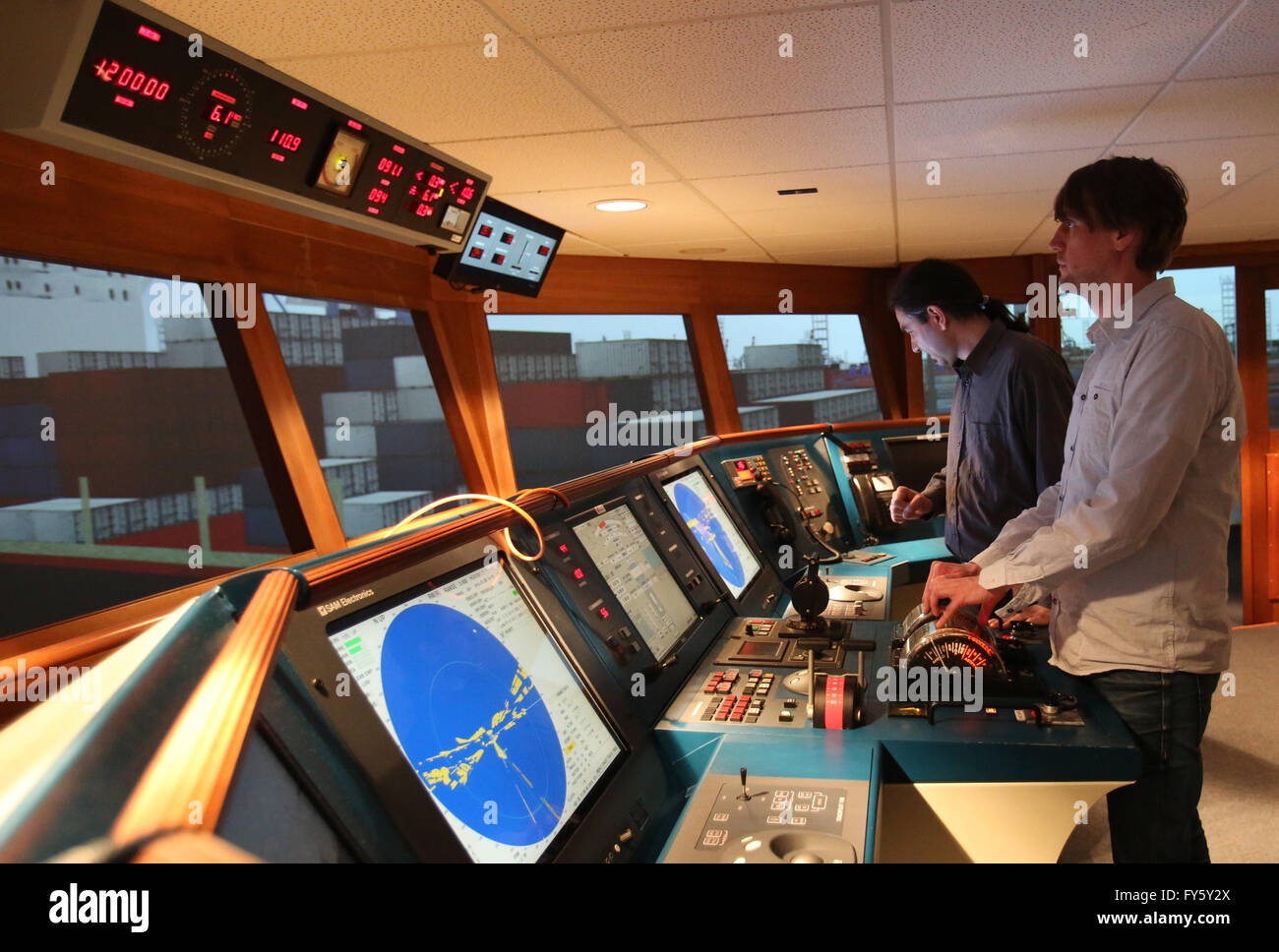 Engineers Sebastian Richter (R) and Robert Lueck of the marine and automation technology Rostock (MAR) GmbH stand at the maritime simulation center (MSCW) of the maritime shipping department of the University of Wismar in Warnemuende, Germany, 22 April 2016. The MSCW is one of over 50 simulation centers which were equipped by the MAR GmbH. These training centers for the education of nautical and technical personnel provide a 360 degree view of all imaginable situations which could occur during the operation of a ship. Photo: Bernd Wuestneck/dpa Stock Photo