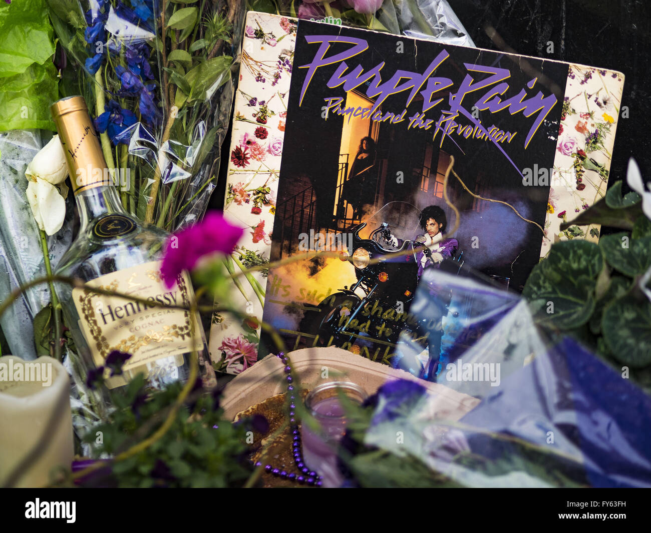 Minneapolis, MN, USA. 22nd Apr, 2016. A copy of Prince's landmark LP ''Purple Rain'' left at 1st Ave in Minneapolis. Thousands of people came to 1st Ave in Minneapolis Friday to mourn the death of Prince, whose full name is Prince Rogers Nelson. 1st Ave is the nightclub the musical icon made famous in his semi autobiographical movie ''Purple Rain.'' Prince, 57 years old, died Thursday, April 21, 2016, at Paisley Park, his home, office and recording complex in Chanhassen, MN. Credit:  Jack Kurtz/ZUMA Wire/Alamy Live News Stock Photo
