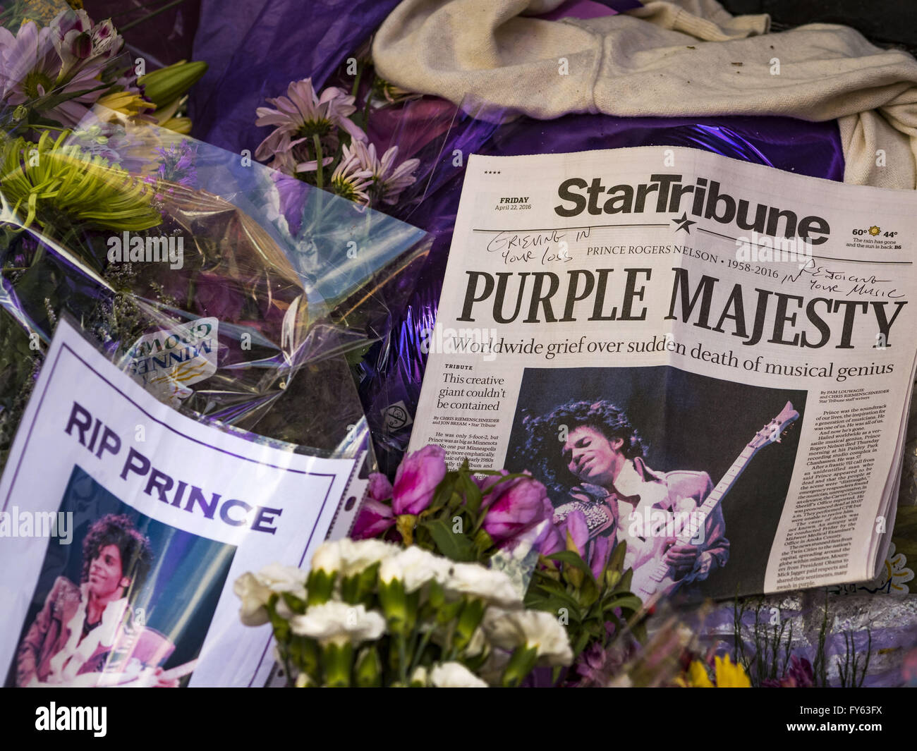 Minneapolis, MN, USA. 22nd Apr, 2016. Part of the memorial for Prince at 1st Ave in Minneapolis. Thousands of people came to 1st Ave in Minneapolis Friday to mourn the death of Prince, whose full name is Prince Rogers Nelson. 1st Ave is the nightclub the musical icon made famous in his semi autobiographical movie ''Purple Rain.'' Prince, 57 years old, passed away Thursday, April 21, 2016, at Paisley Park, his home, office and recording complex in Chanhassen, MN. Credit:  Jack Kurtz/ZUMA Wire/Alamy Live News Stock Photo