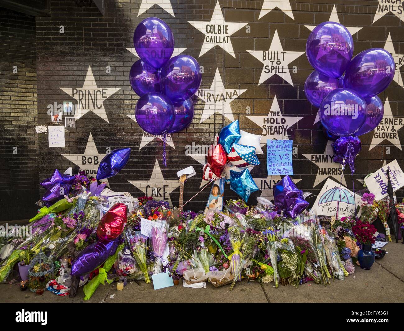 Minneapolis, MN, USA. 22nd Apr, 2016. The memorial for Prince at 1st Ave, a nightclub and concert venue in Minneapolis. Thousands of people came to 1st Ave in Minneapolis Friday to mourn the death of Prince, whose full name is Prince Rogers Nelson. 1st Ave is the nightclub the musical icon made famous in his semi autobiographical movie ''Purple Rain.'' Prince, 57 years old, passed away Thursday, April 21, 2016, at Paisley Park, his home, office and recording complex in Chanhassen, MN. Credit:  Jack Kurtz/ZUMA Wire/Alamy Live News Stock Photo