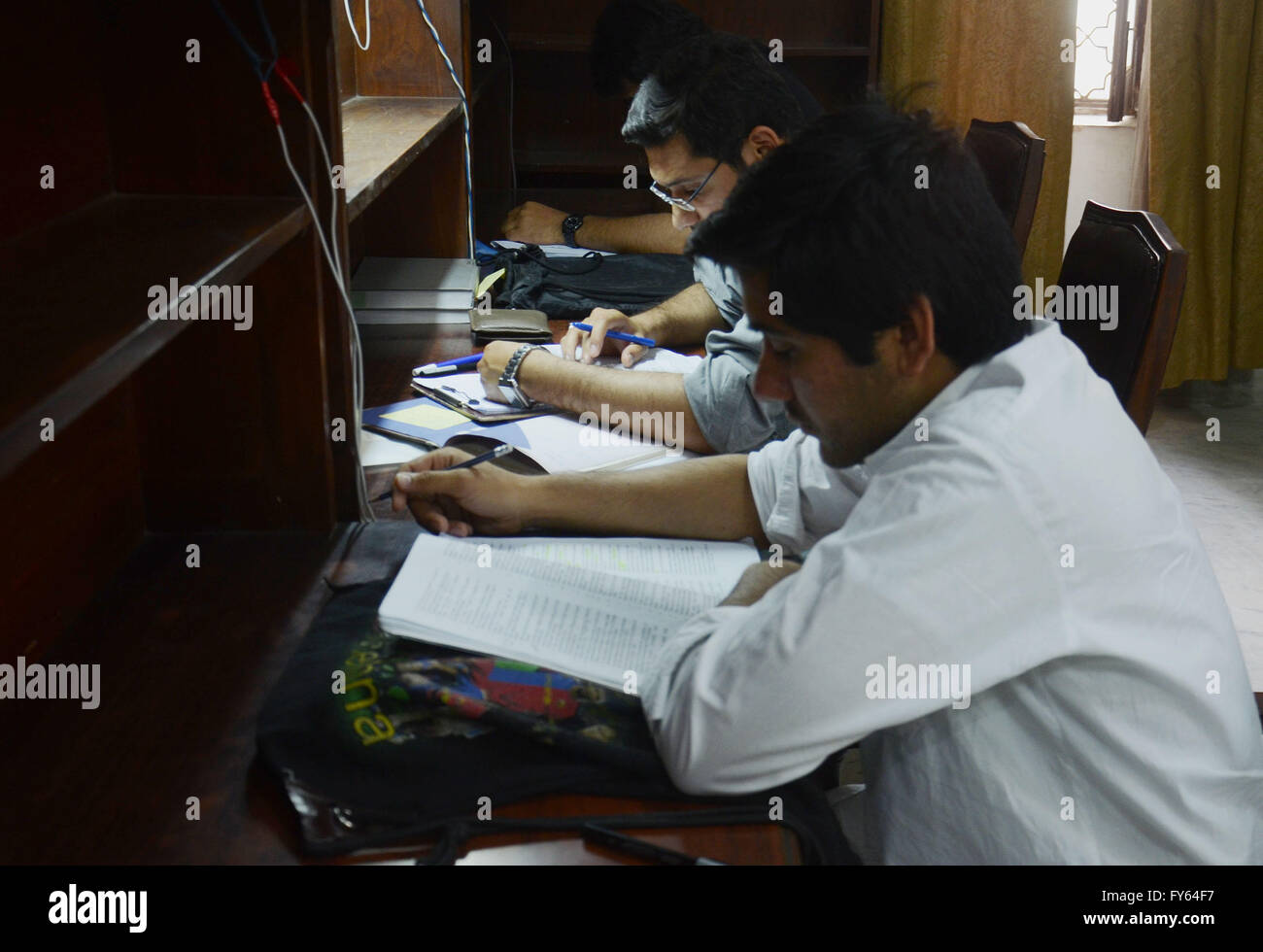 Lahore, Pakistan. 22nd Apr, 2016. Pakistani students reading books at Jinnah Garden Quaid-e-Azam library on the eve of World Book and Copyright Day. International Day of the Book or World Book Days, is a yearly event on April 23rd, organized by the United Nations Educational, Scientific and Cultural Organization (UNESCO), to promote reading, publishing and copyright. In the United Kingdom, the day is recognized on the first Thursday in March. © Rana Sajid Hussain/Pacific Press Agency/Alamy Live News Stock Photo