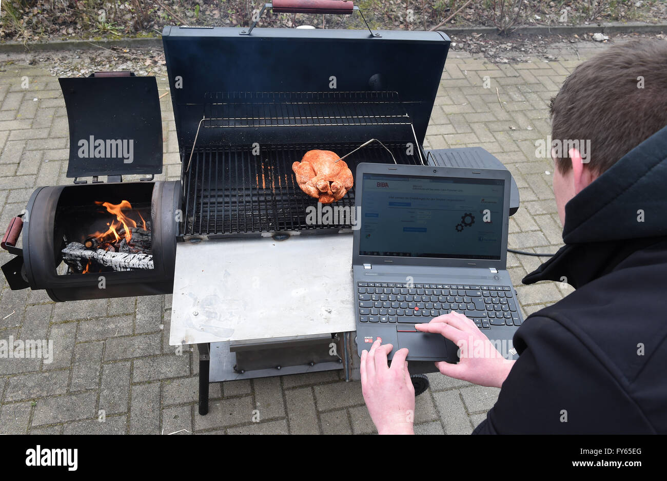 Bremen, Germany. 20th Apr, 2016. A chicken and a temperature sensor lying on a Smoker grill that is being programmed in Bremen, Germany, 20 April 2016. Production Technology students equipped the Smoker grill with a mini processor which controls the fresh air supply. PHOTO: CARMEN JASPERSEN/dpa/Alamy Live News Stock Photo