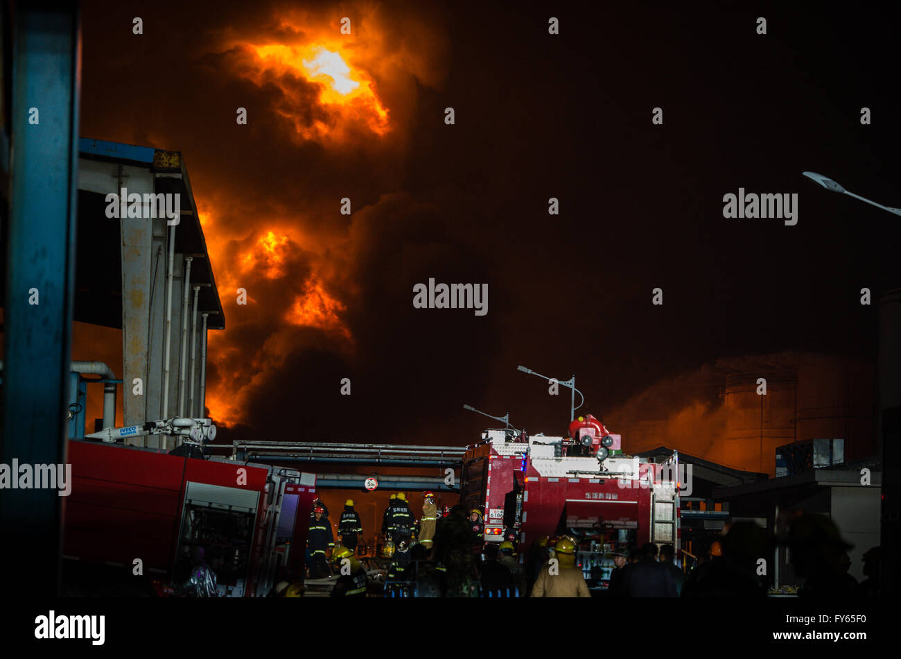 Jingjiang, China's Jiangsu Province. 22nd Apr, 2016. Firefighters try to extinguish blaze at a chemical storage of Deqiao Storage Company in Jingjiang City, east China's Jiangsu Province, April 22, 2016. Blaze has been fully put down by 1:50 a.m. on April 23 and no casualties are reported. The fire occurred around 9 a.m. on April 22. Among the 42 tanks at the storage, 12 are gasoline tanks, the rest 30 contain dangerous chemicals including alcohol and lipid. Credit:  Li Xiang/Xinhua/Alamy Live News Stock Photo
