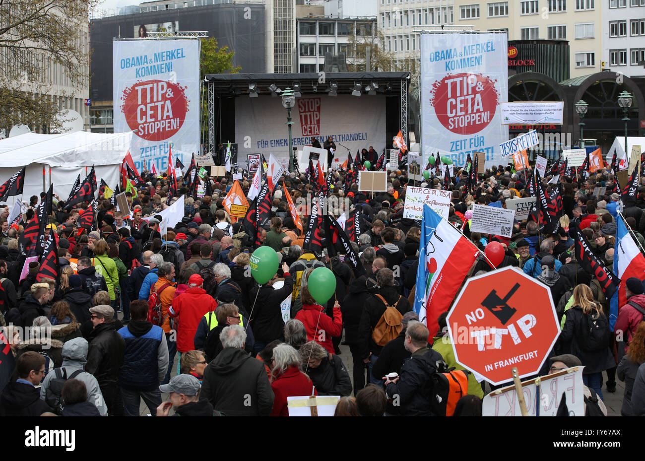 Hanover, Germany. 23rd Apr, 2016. Thousands of demonstrators gathering for a demonstration against the controversial transatlantic trade agreement TTIP at Opera Square in Hanover, Germany, 23 April 2016. Organisations for environment and consumer protection as well as for third world relief fear sinking ecological and social standards in Europe and that the agreement gives more power to big corportations. US-President Obama visits the Hanover Messe fair from 24 to 25 April 2016 in Hanover. PHOTO: CHRISTIAN CHARISIUS/dpa/Alamy Live News Stock Photo