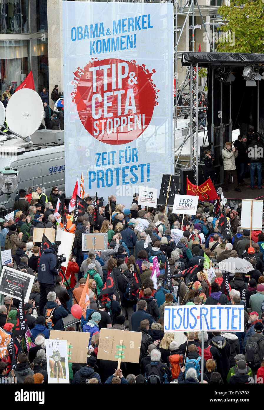 Hanover, Germany. 23rd Apr, 2016. Thousands of demonstrators gathering for a demonstration against the controversial transatlantic trade agreement TTIP at Opera Square in Hanover, Germany, 23 April 2016. Organisations for environment and consumer protection as well as for third world relief fear sinking ecological and social standards in Europe and that the agreement gives more power to big corportations. US-President Obama visits the Hanover Messe fair from 24 to 25 April 2016 in Hanover. PHOTO: HOLGER HOLLEMANN/dpa/Alamy Live News Stock Photo