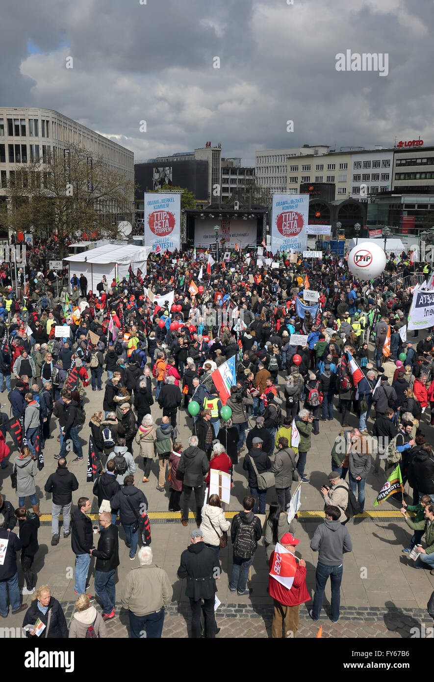 Hanover, Germany. 23rd Apr, 2016. Thousands of demonstrators gathering for a demonstration against the controversial transatlantic trade agreement TTIP at Opera Square in Hanover, Germany, 23 April 2016. Organisations for environment and consumer protection as well as for third world relief fear sinking ecological and social standards in Europe and that the agreement gives more power to big corportations. US-President Obama visits the Hanover Messe fair from 24 to 25 April 2016 in Hanover. PHOTO: CHRISTIAN CHARISIUS/dpa/Alamy Live News Stock Photo