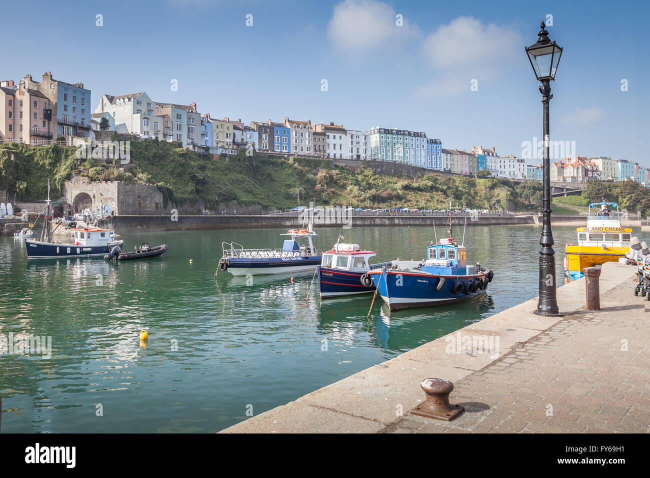 Boats and buildings in the harbor at Tenby, Pembrokeshire, Wales.  Taken on a sunny day. Stock Photo