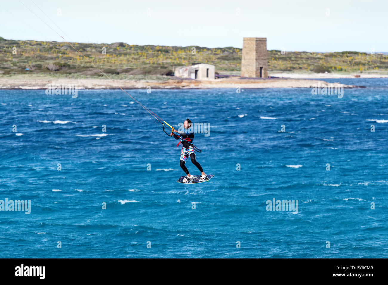 flying with kitesurf in Stintino la pelosa beach Stock Photo