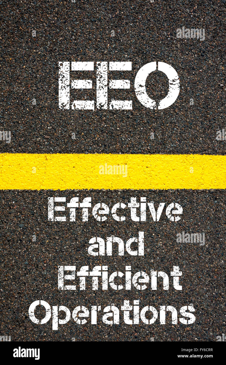 Concept image of Business Acronym EEO Effective and Efficient Operations written over road marking yellow paint line Stock Photo