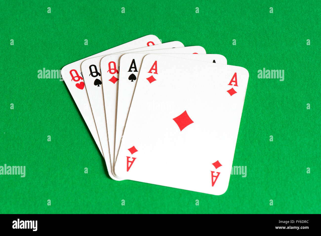 Playing card on green table, Full house Stock Photo