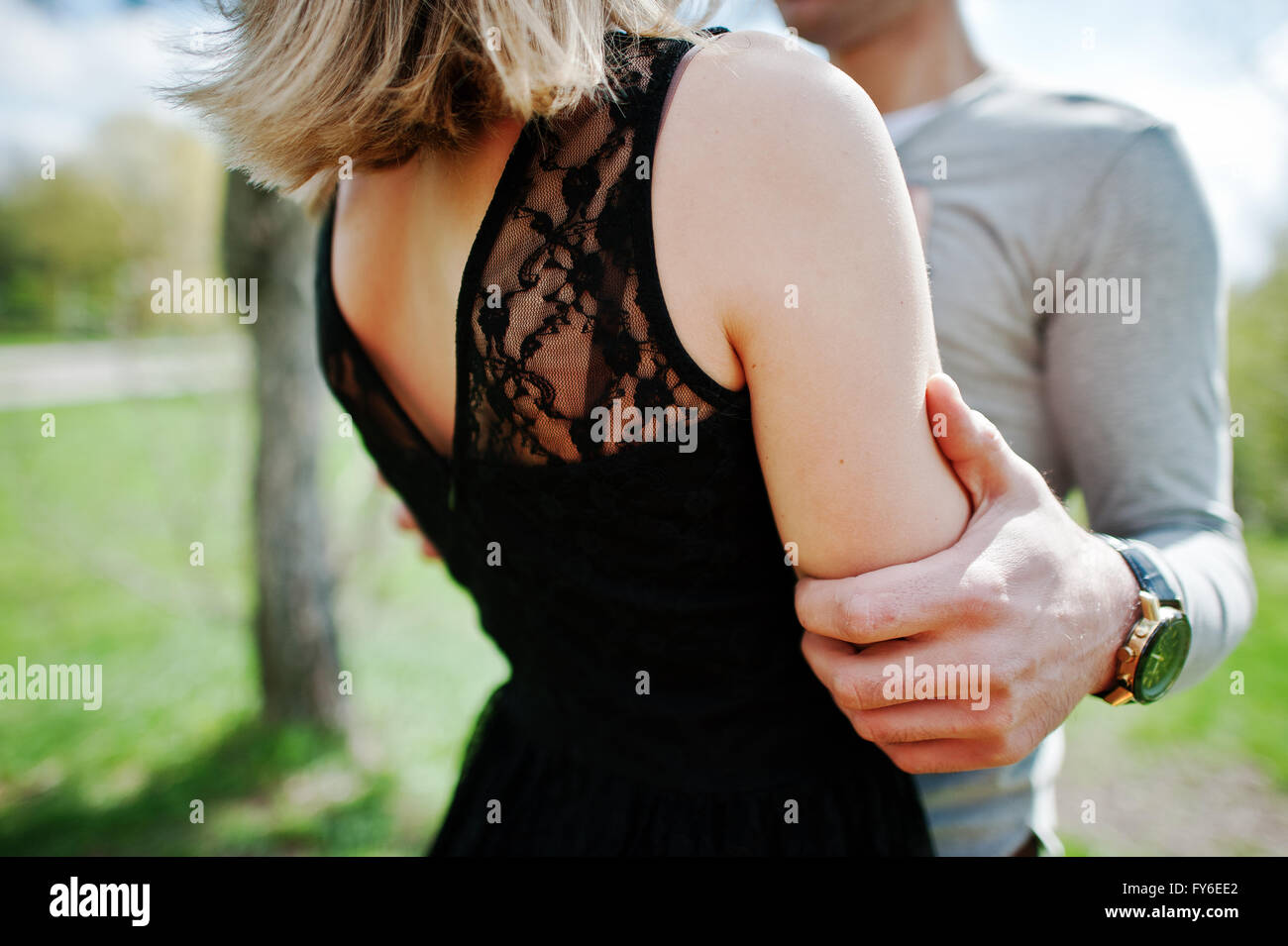 Close up of hand of boy who hug his girlfriend. Couple in love Stock ...