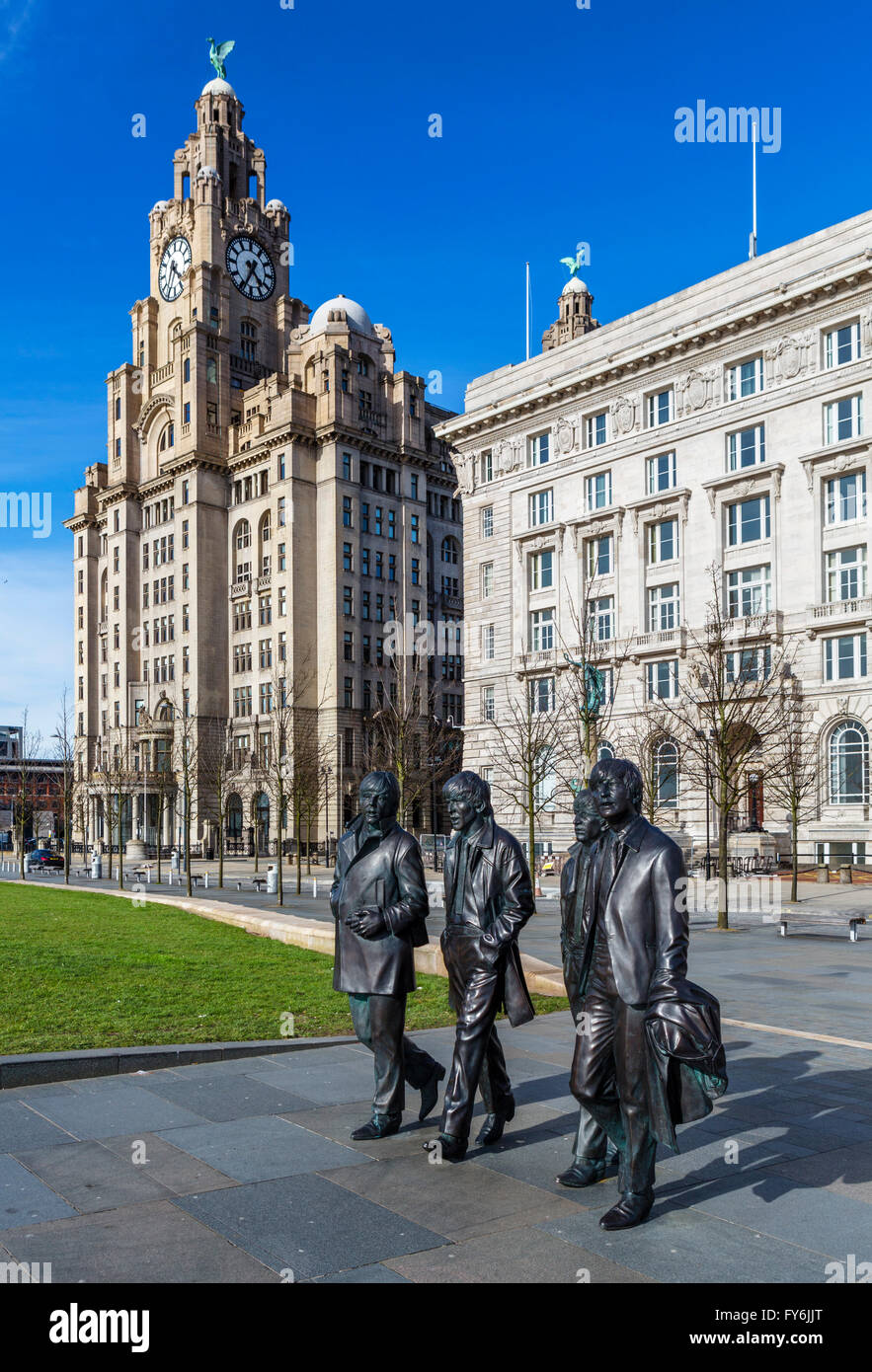 Andrew Edward's sculpture of The Beatles in front of the Royal Liver and Cunard buildings, Pier Head, Liverpool, England, UK Stock Photo