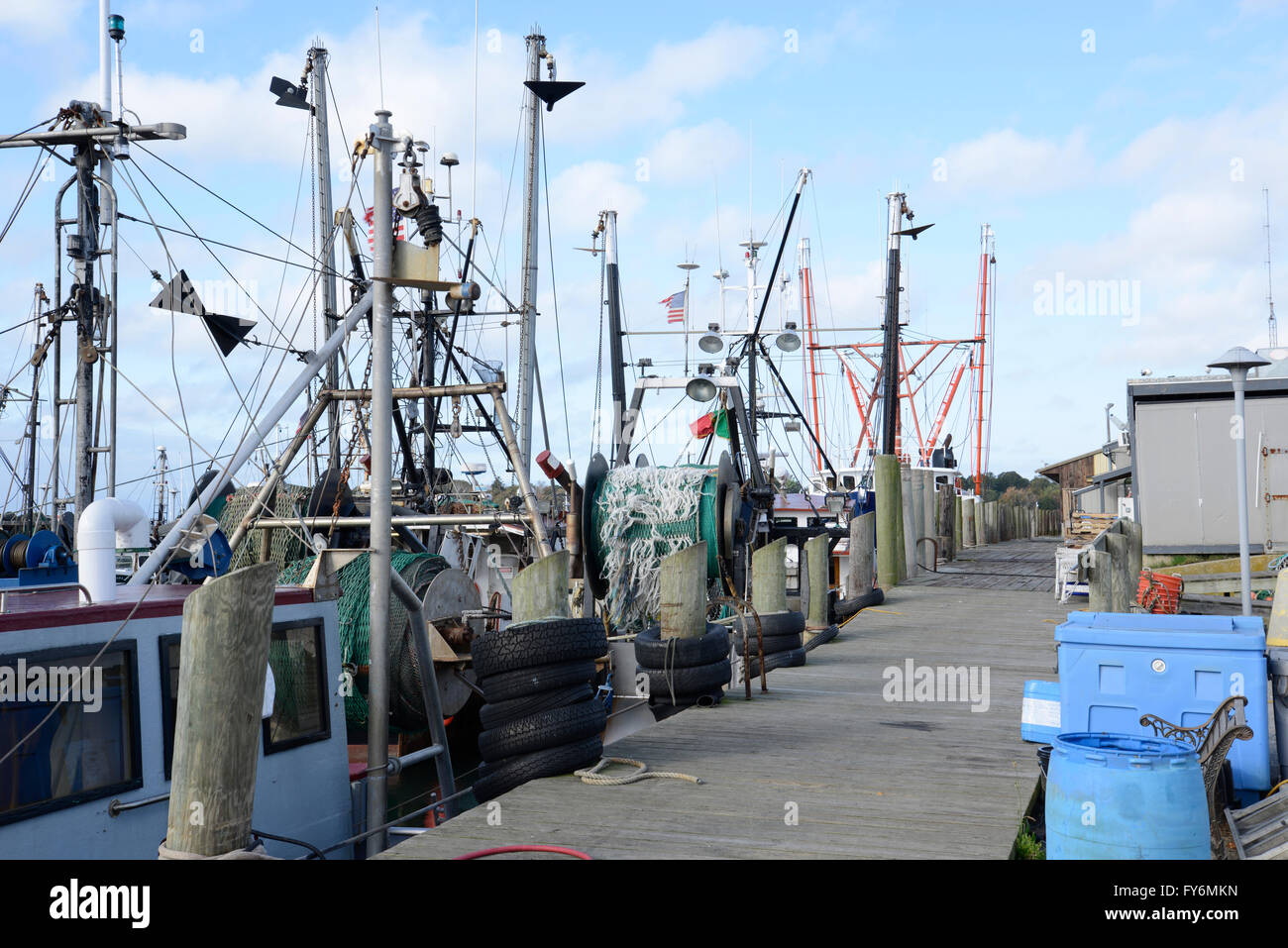 several commercial fishing boats docked in a marina in Stonington