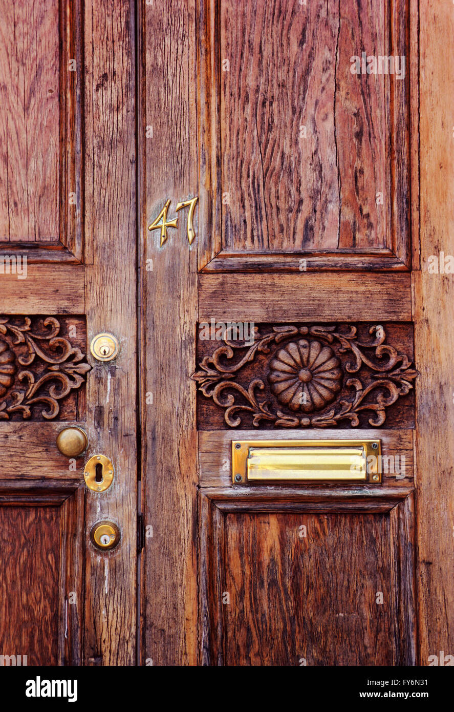 Wooden door & brass hardware of historic old house in downtown