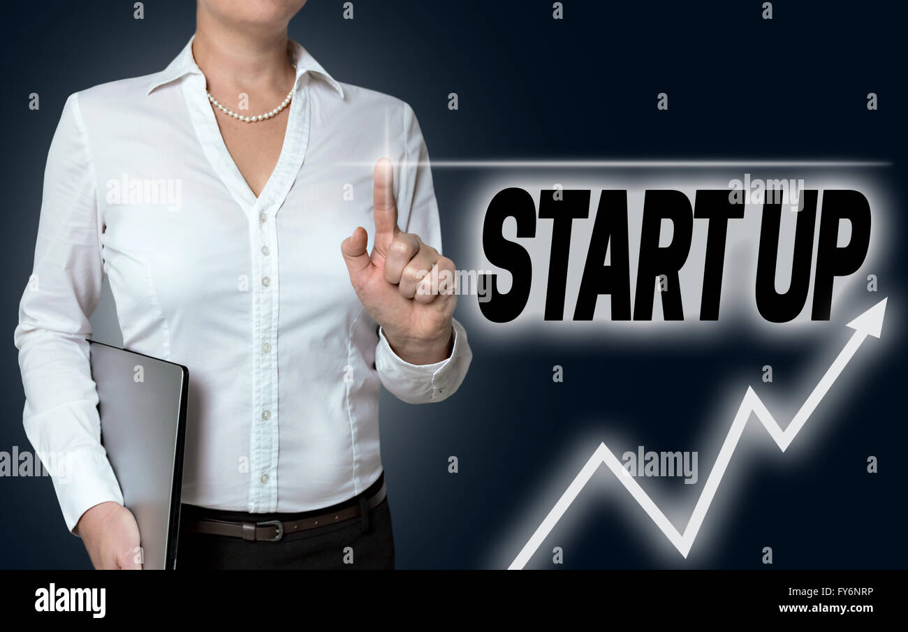 start up touchscreen is operated by businesswoman. Stock Photo
