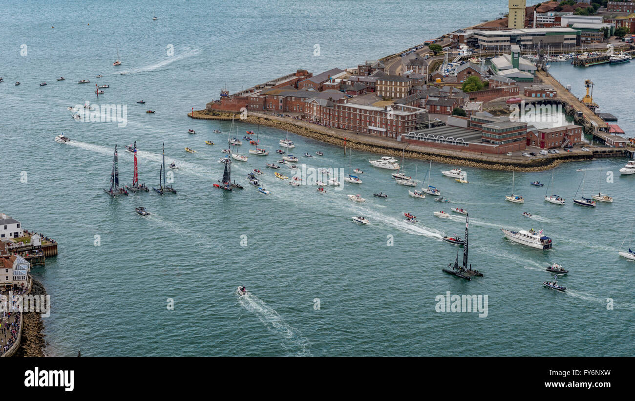 Aerial View of America's Cup Teams Leaving Portsmouth harbour for Day 3 of America's Cup Portsmouth 2015, with flotilla of small boats Stock Photo