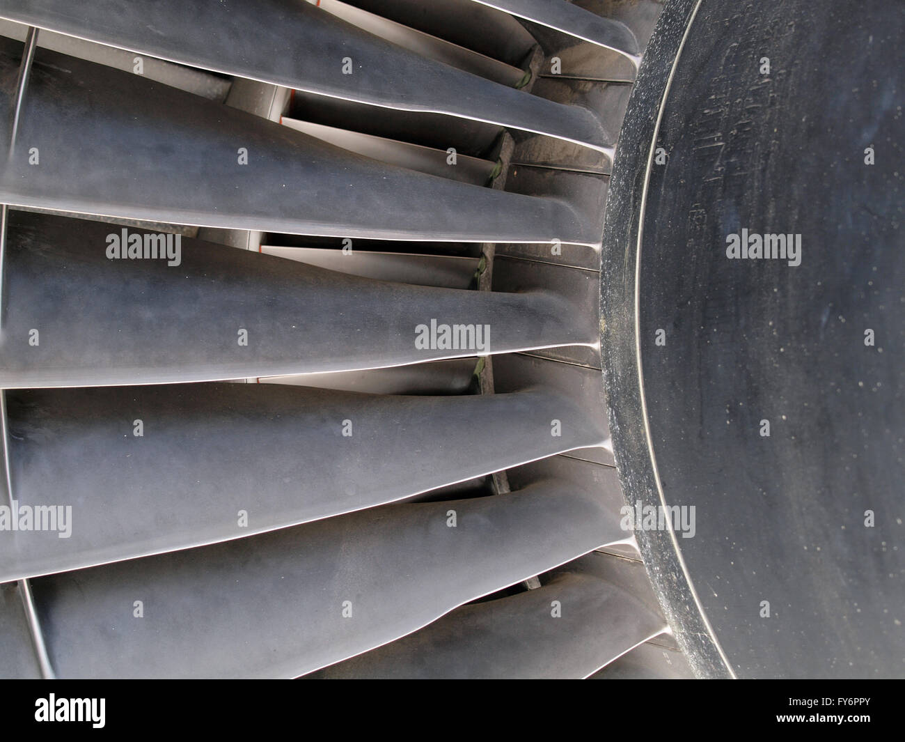 Close up of turbine and fan blades of a jet engine with signs of wear. Stock Photo