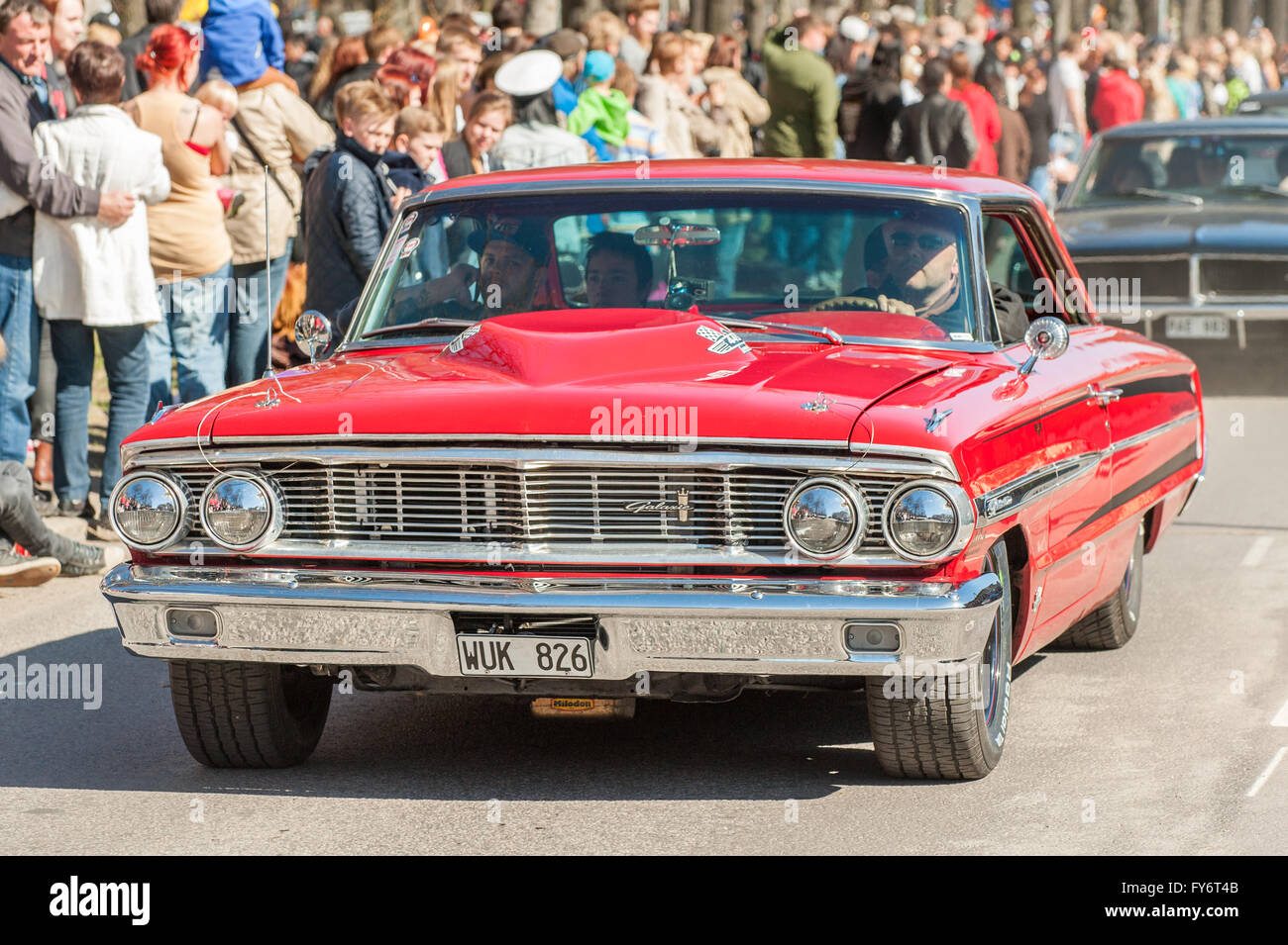 Traditional vintage car parade celebrates spring on May Day in Norrkoping, Sweden. Stock Photo