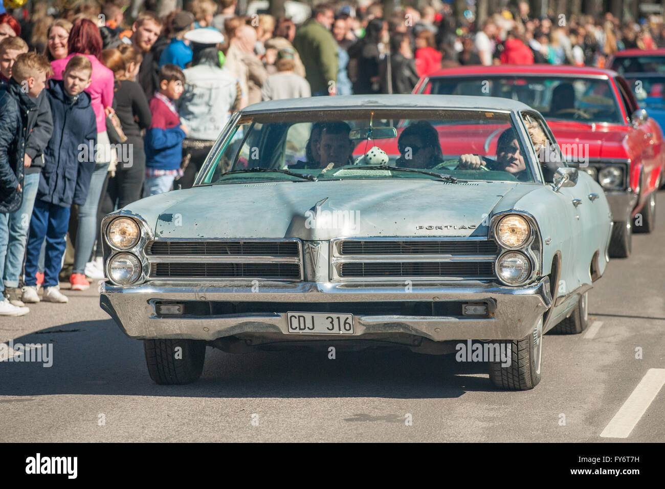 Traditional vintage car parade celebrates spring on May Day in Norrkoping, Sweden. Stock Photo