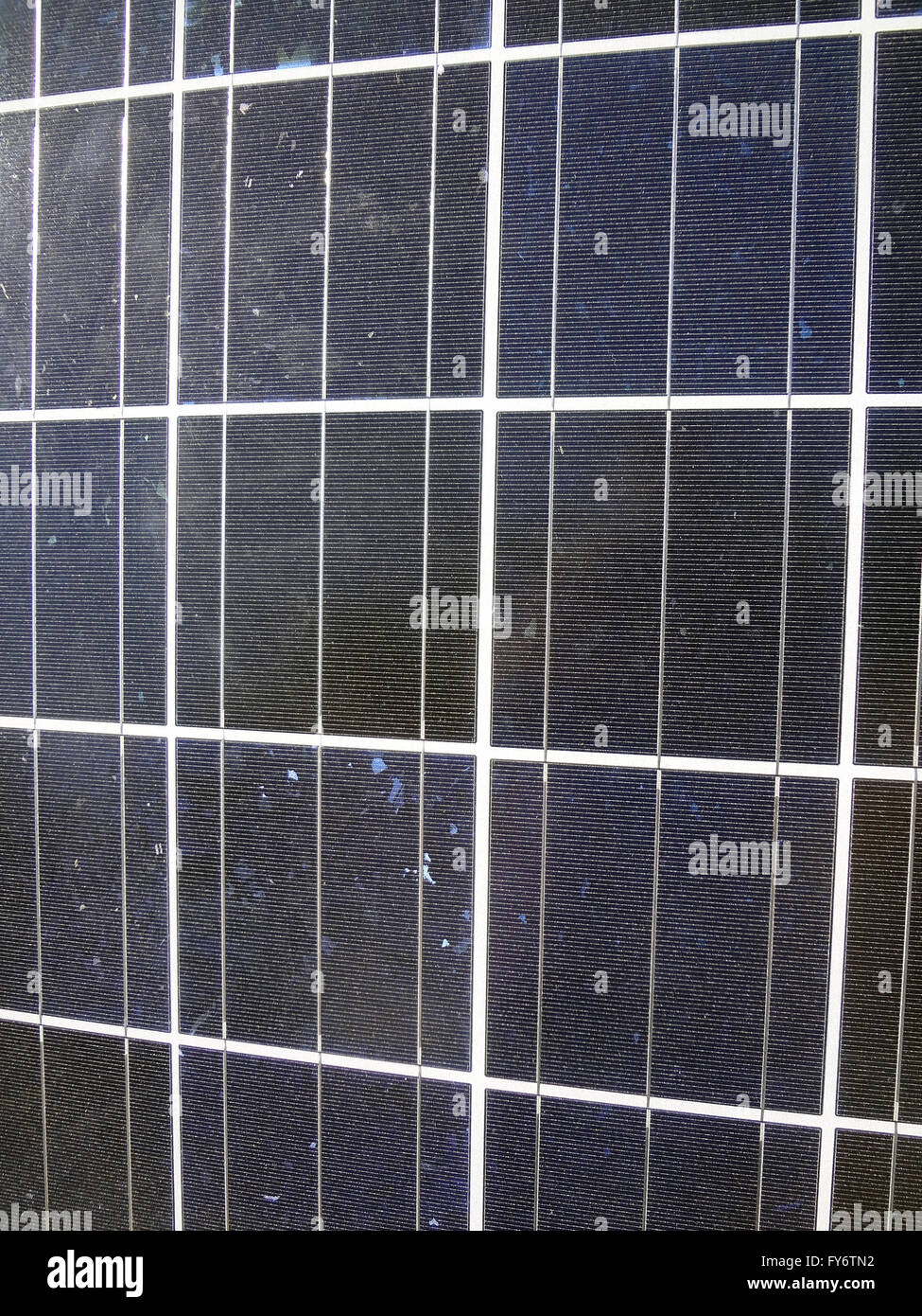 Close-up of Solar Panel with a lite layer of dirt on top of the panel Stock Photo
