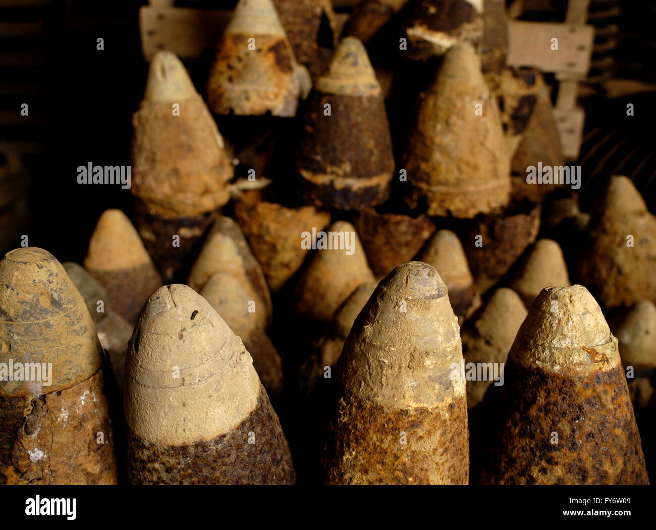 AJAXNETPHOTO. CHUIGNES, SOMME, FRANCE. - IRON HARVEST - SOME OF THE HUNDREDS OF TONS OF LETHAL FIRST WORLD WAR MUNITIONS RECOVERED FROM FARMERS FIELDS IN FRANCE AND BELGIUM EACH YEAR. PICTURED; UNEXPLODED SHELLS IN A FARM SHED.  PHOTO:JONATHAN EASTLAND/AJAX  REF:D111903 1026 Stock Photo