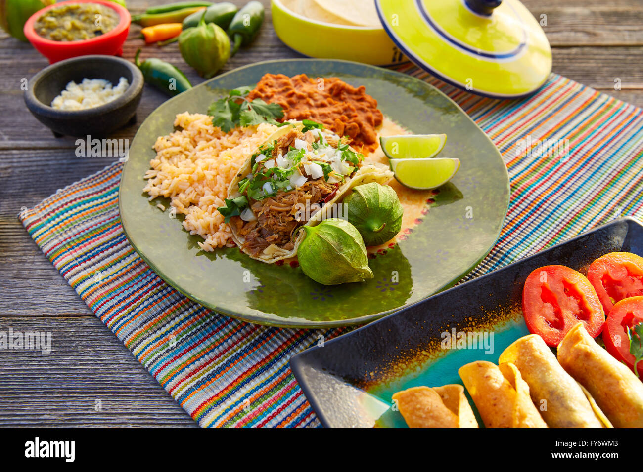 Mexican carnitas tacos with salsa and Mexico food ingredients Stock