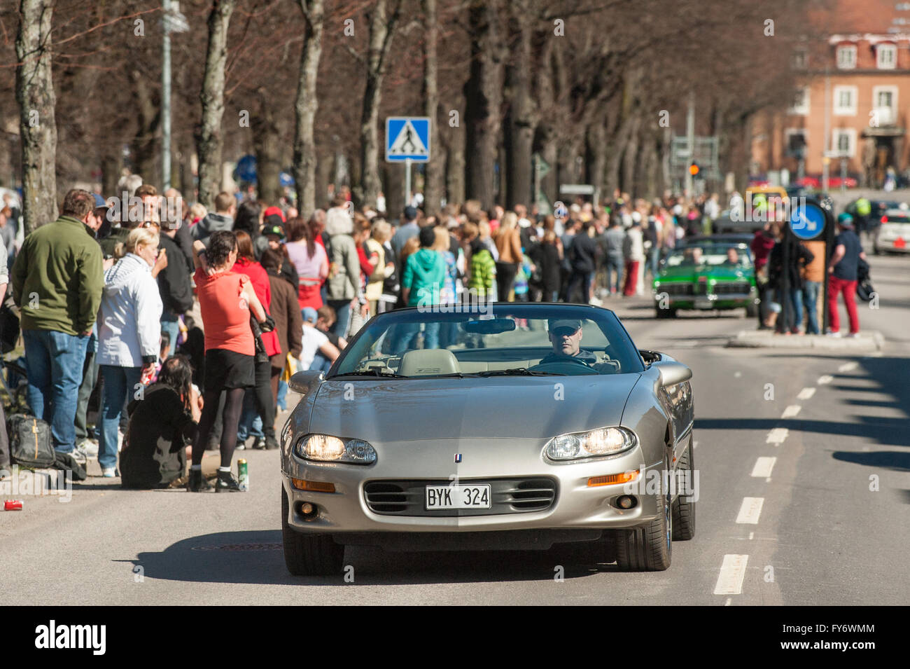 Traditional vintage car parade celebrates spring on May Day in Norrkoping, Sweden. Stock Photo