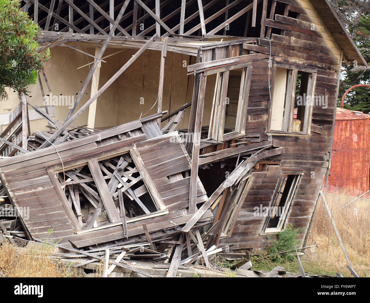 Falling apart house in a dry forest on Angel Island Stock Photo