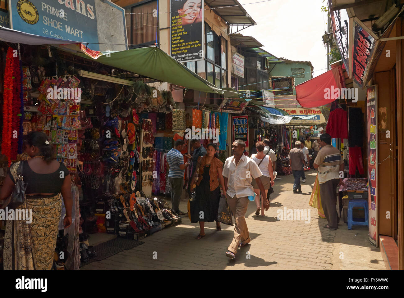 Street scene in Kandy with many people shopping and walking around the busy shops Stock Photo