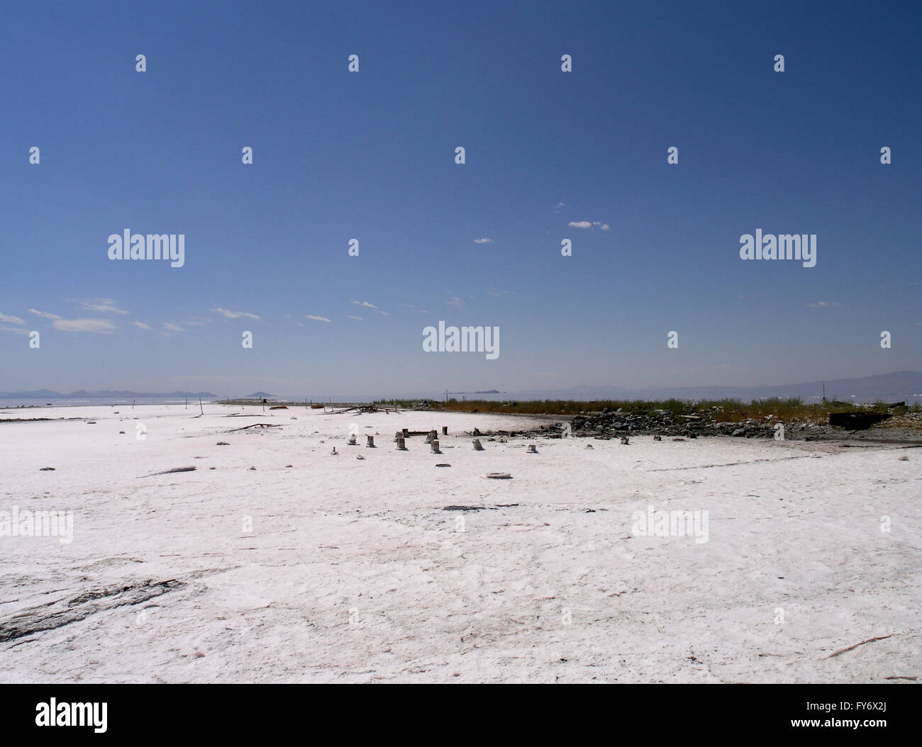 Salt field with bits of long forgotten industrial things visible in a remote area of Salt Lake, Utah Stock Photo