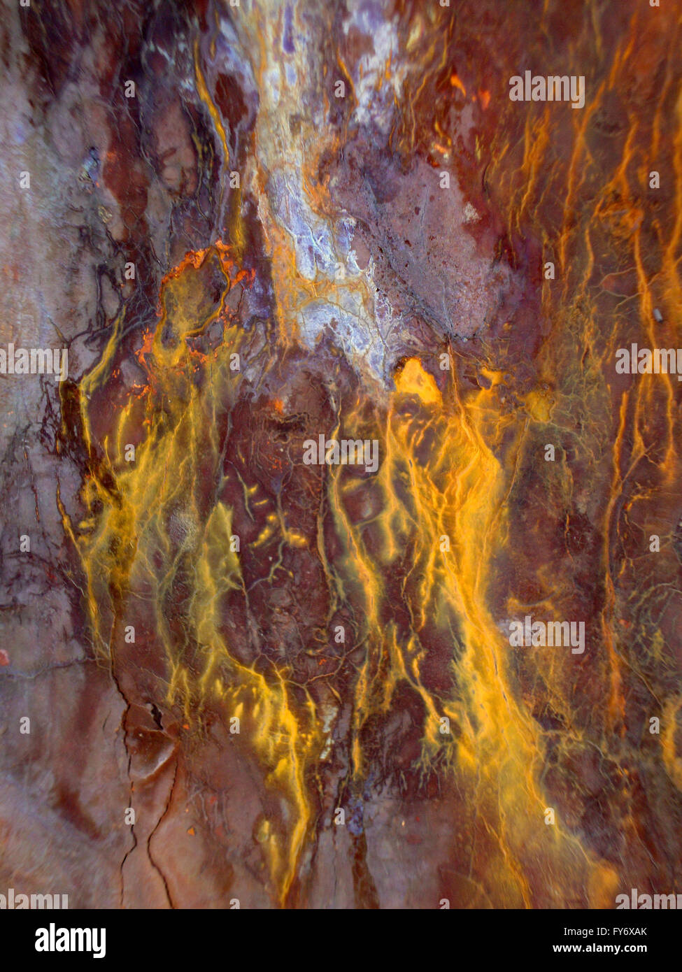 Rusted Metal cracks and bleeds colors from exposure to salt air.  Great for backgrounds. Stock Photo