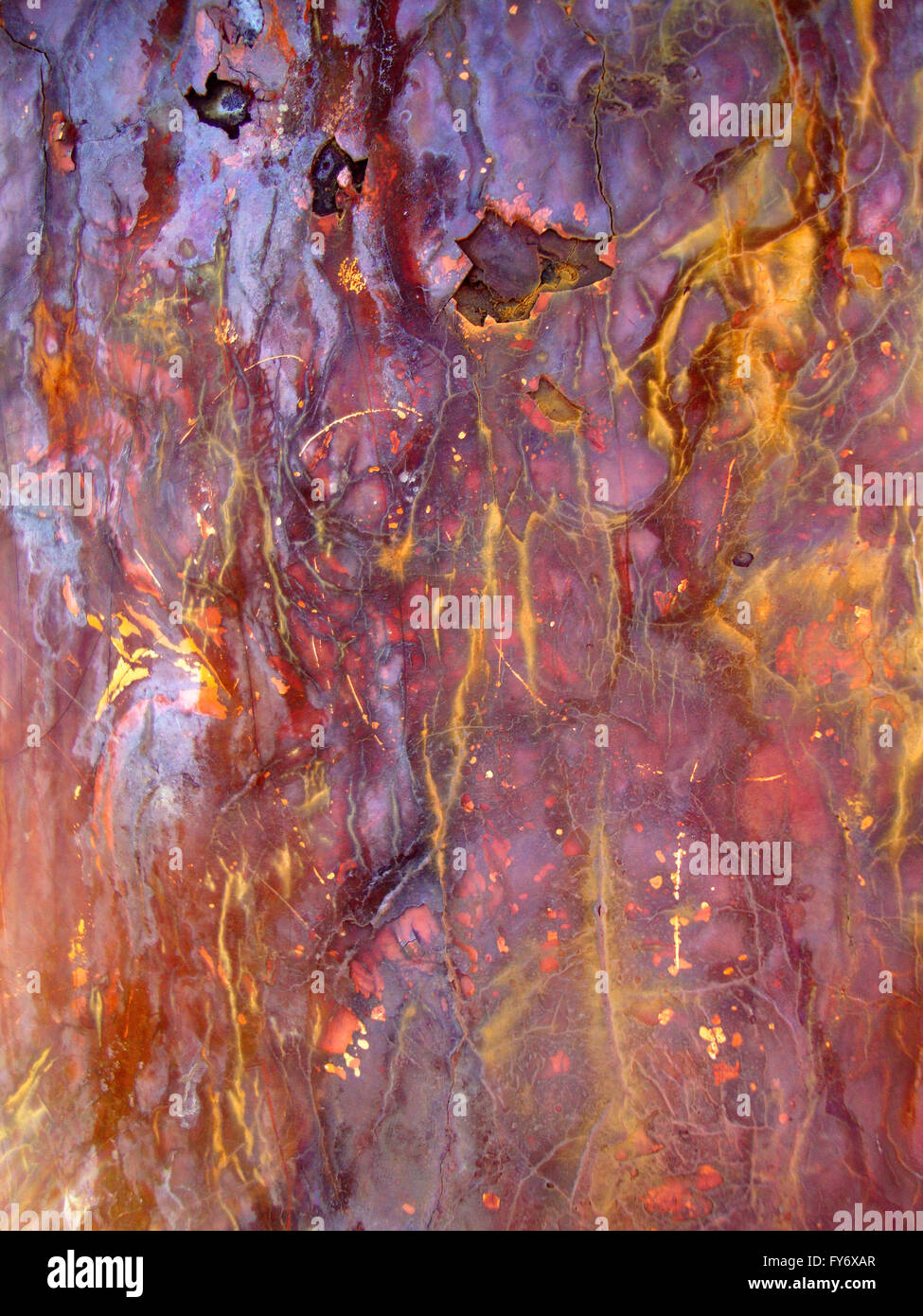 Rusted Metal cracks and bleeds colors from exposure to salt air.  Great for backgrounds. Stock Photo