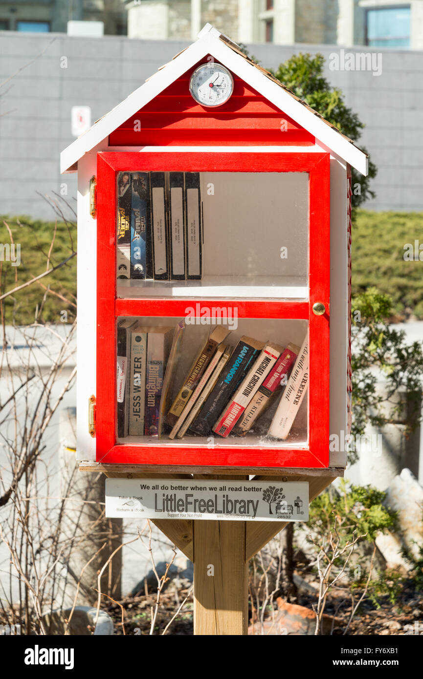 Free Library is a street-level book deposit where everyone can take or give a book, free of charge (Ottawa, Canada) Stock Photo
