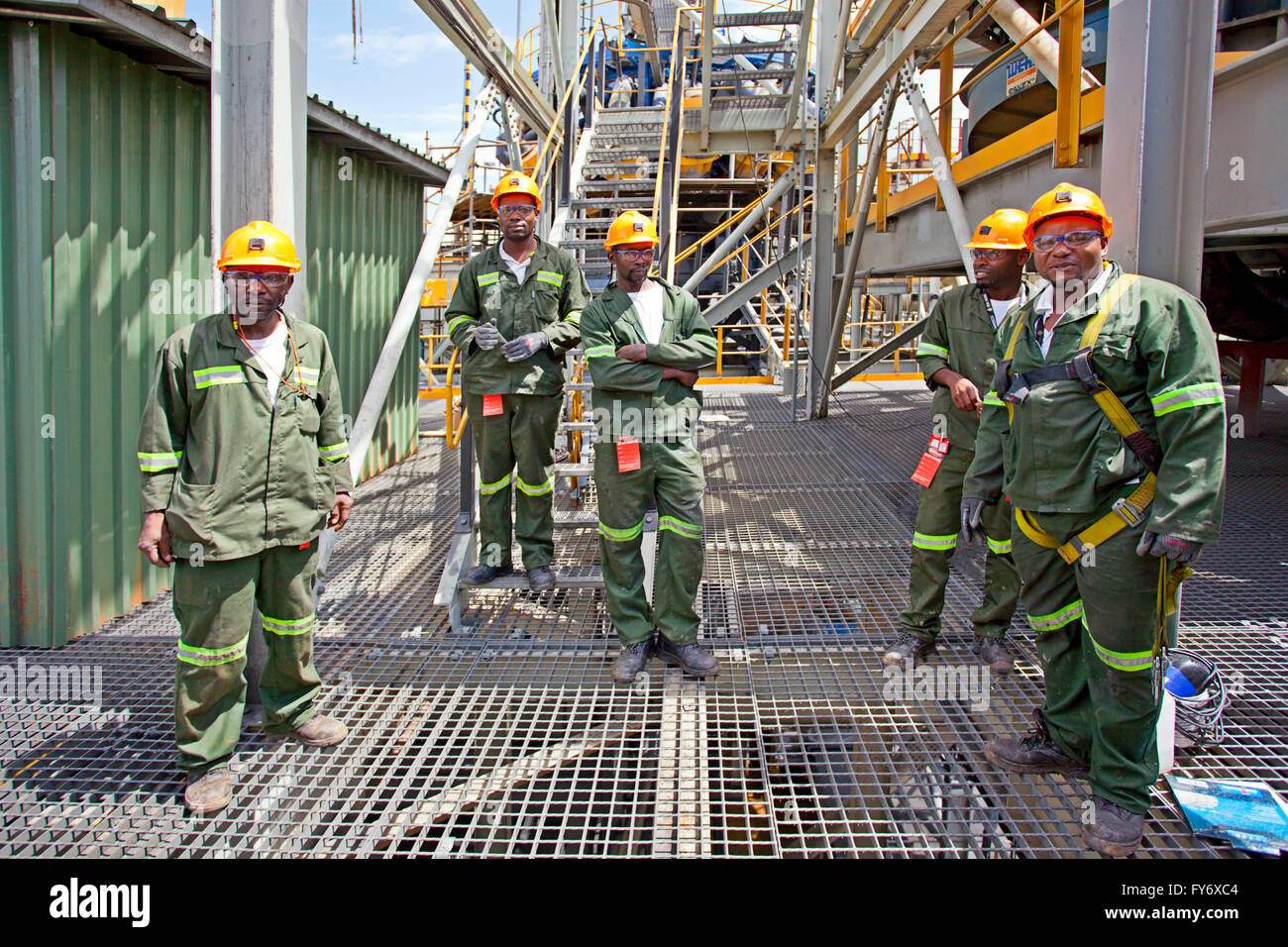 Group of First Quantum mine employees posing on site Stock Photo