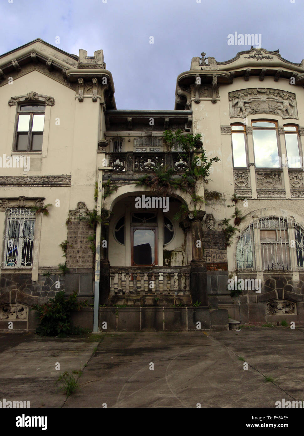 Plants begin to over grow historic home in San Jose, Costa Rica Stock