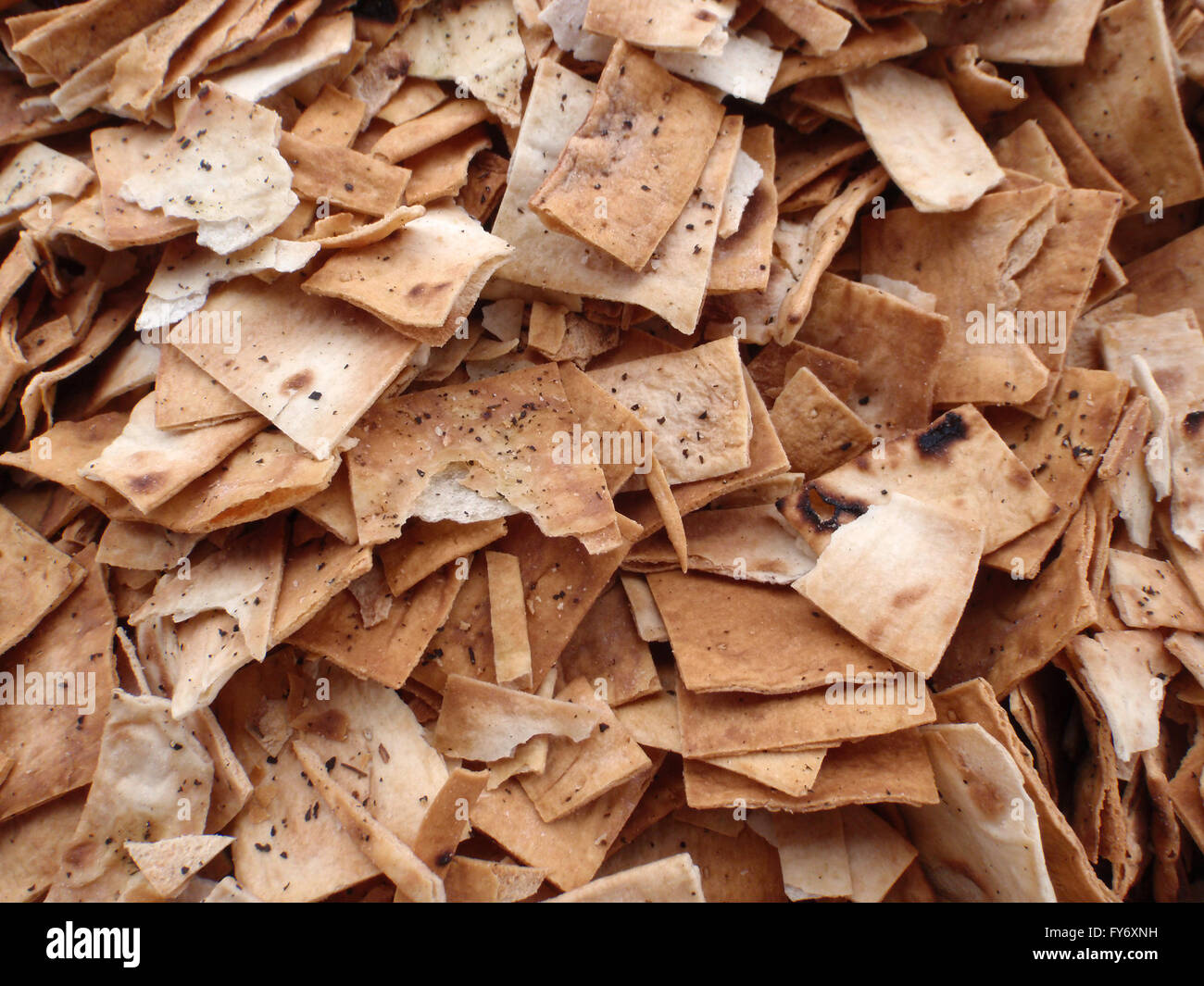 Pile of square and broken Pita Chips pattern used for dipping into jam samples Stock Photo