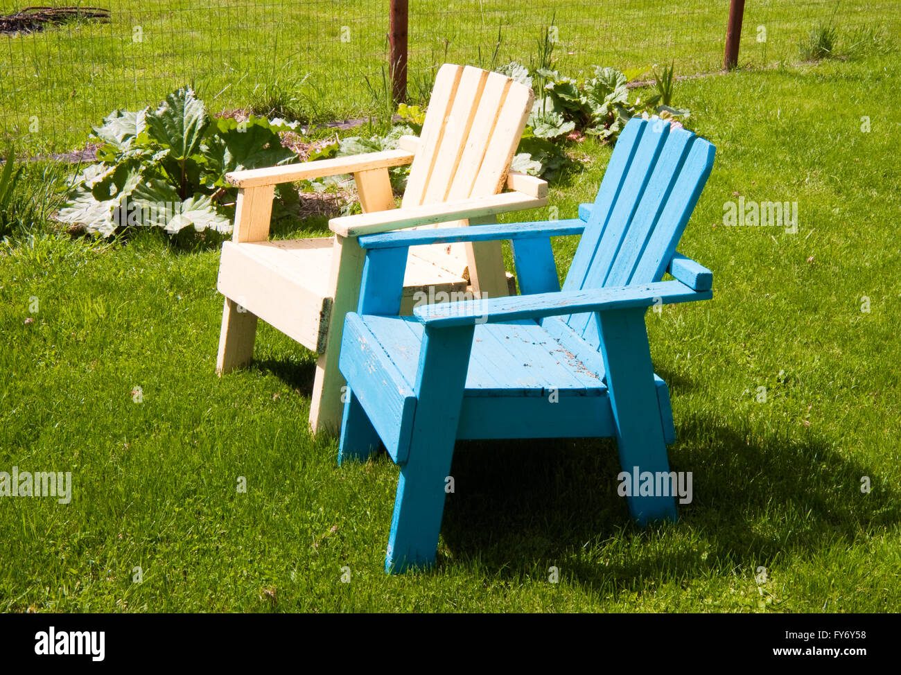 Sunlit lawn chairs Stock Photo Alamy