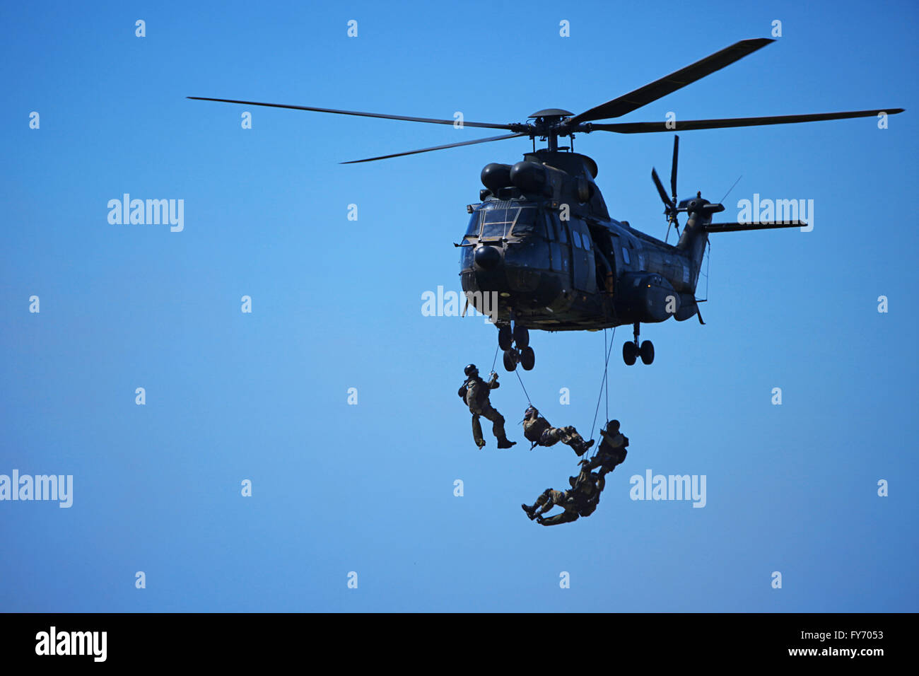 Helicopter with paratroopers Stock Photo