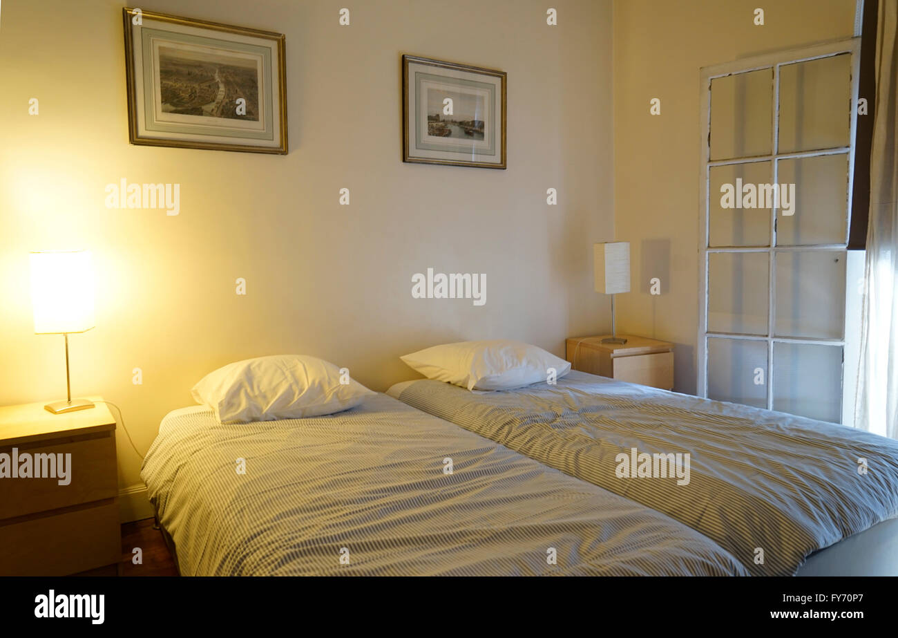 Bedroom in a Airbnb rental apartment in 16th arrondissement in Paris. France Stock Photo