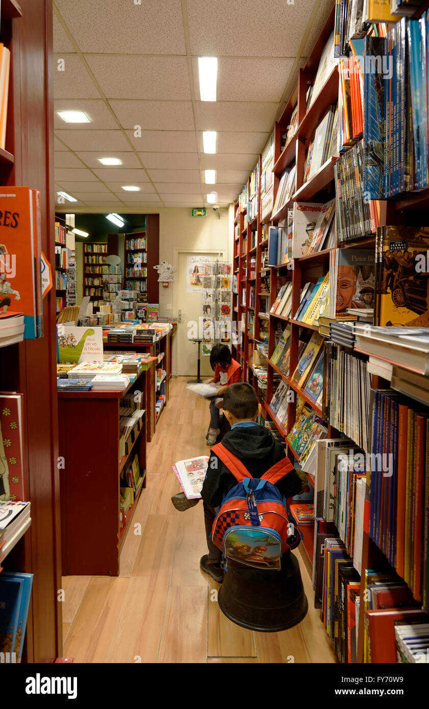 Children reading books inside of a bookstore in Saint Germain des Pres