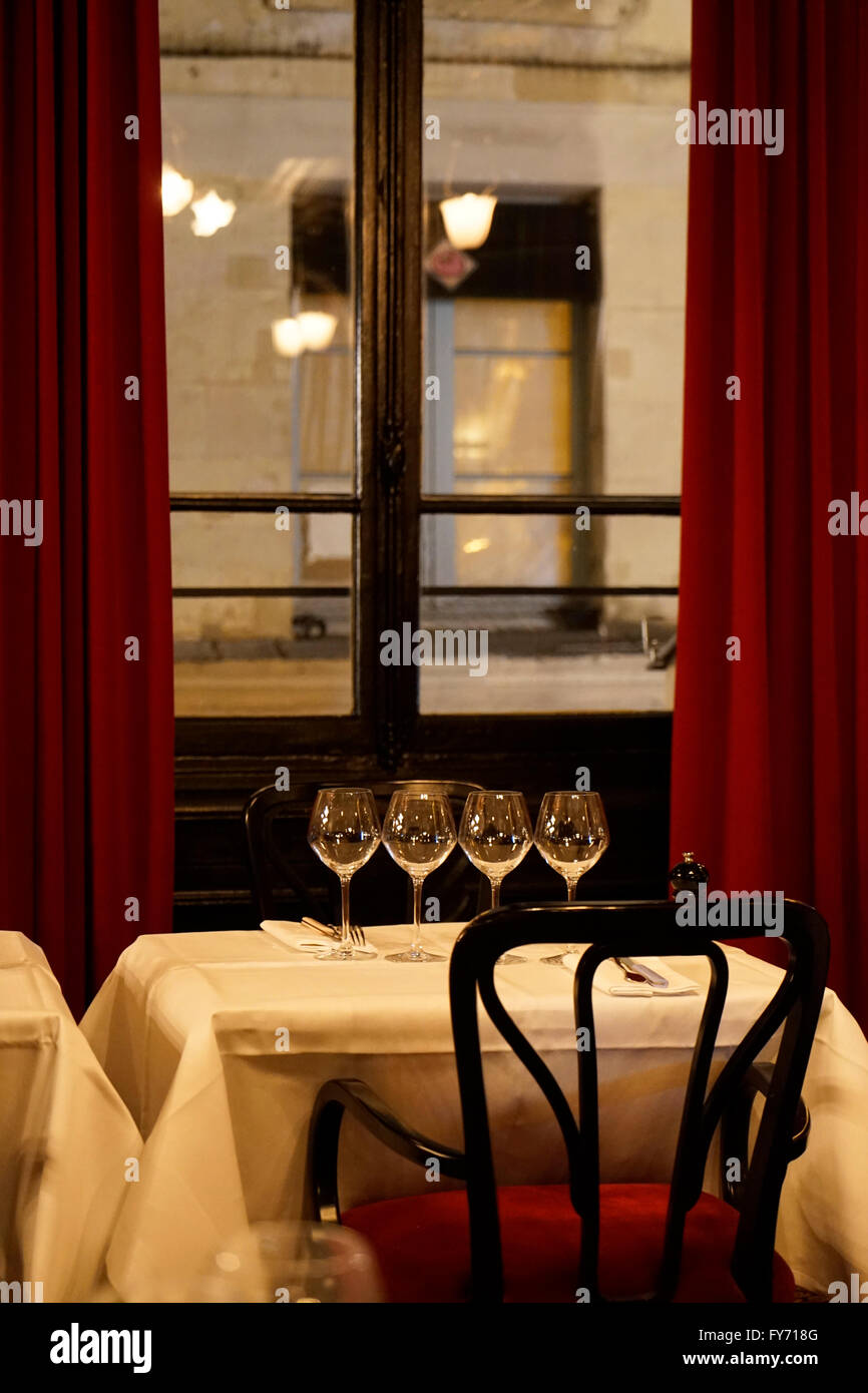 Interior view and table setting of L'Escargot restaurant in
