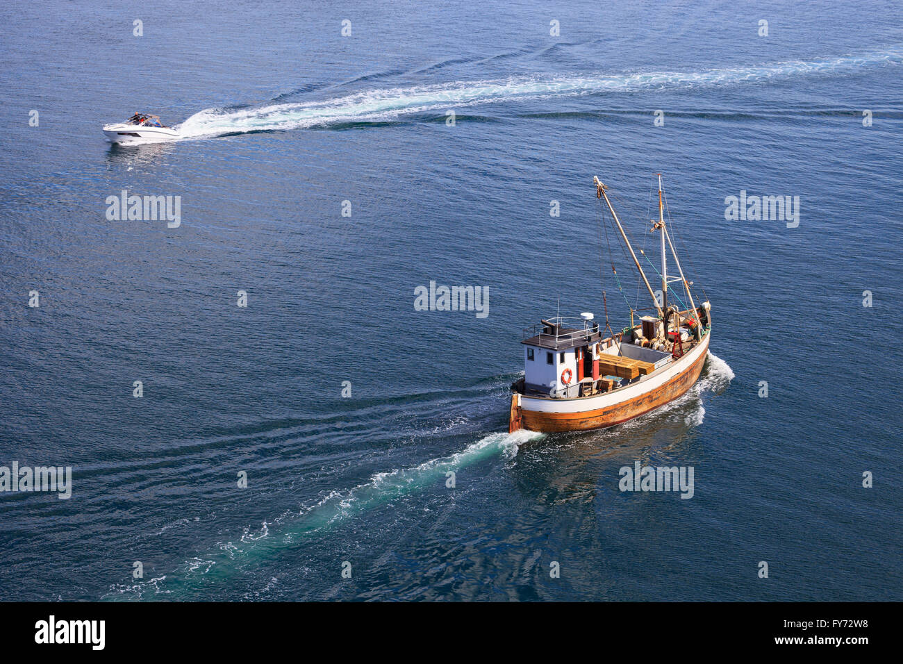 Old wooden fishing boat trawler on sea Stock Photo - Alamy
