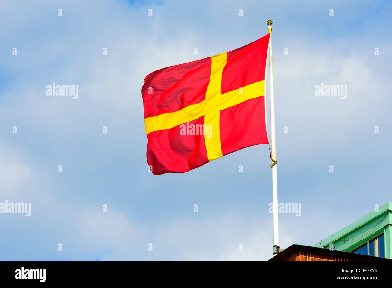 The red and yellow regional flag of Scania or Skane in Sweden. Stock Photo