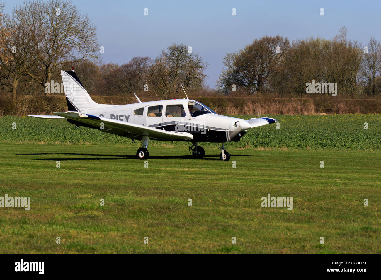 Piper PA-28-181 Cherokee Warrior G-BIEY commencing take-off run at Breighton Airfield Stock Photo