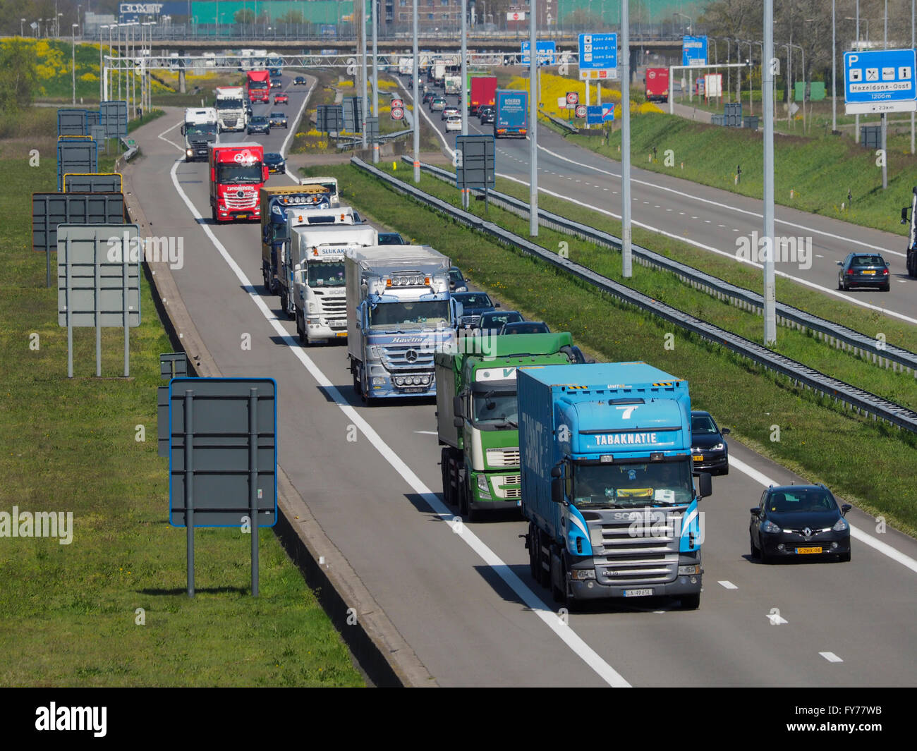 Lots of trucks traffic on the E19 near the Belgian-Dutch border at Hazeldonk (looking towards the Netherlands Stock Photo
