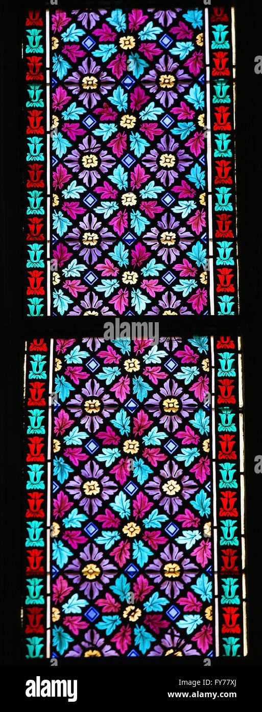 Stained Glass window in St. Vitus Cathedral, Prague, a symmetrical pattern of flowers and leaves. Stock Photo