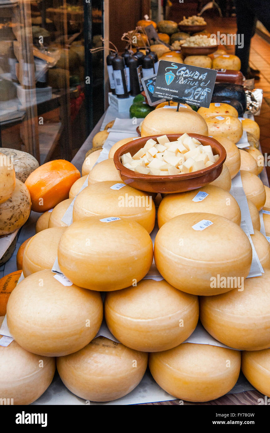 Amsterdam, Netherlands. Typical forms of Gouda, the typical and delicious Dutch cheese, exposed in a cheese shop in the city. Stock Photo